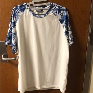 white and blue tropical shirt